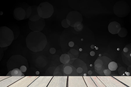 light of bokeh water dot color black and white on real wood boardの写真素材