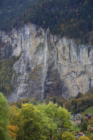 View of Landscape waterfall from forest on mountain in nature and environment at swissの写真素材