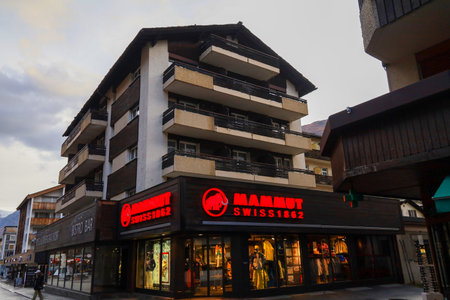 Zermatt, Switzerland-October 21, 2019:The wood Old Building on Zermatt Bahnhofstrasse street in autumn and rainny day. ,Zermatt is a famous nature village in Switzerland.のeditorial素材