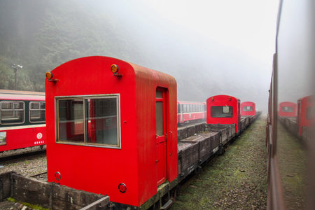 Alishan,taiwan-October 14,2018:Red train stop in foggy day at alishan train station on alishan...