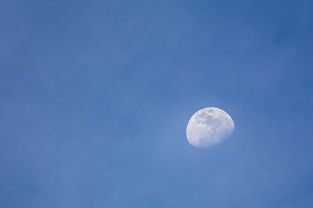 The moon on the blue sky in thailandの写真素材