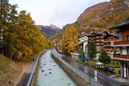 Zermatt, Switzerland-October 21, 2019:The Old Building on Zermatt Bahnhofstrasse street in autumn and rainny day. ,Zermatt is a famous nature village in Switzerland.のeditorial素材
