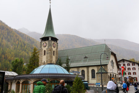 Zermatt, Switzerland-October 21, 2019:The Old chuch Building on Zermatt Bahnhofstrasse street in autumn and rainny day. ,Zermatt is a famous nature village in Switzerland.のeditorial素材