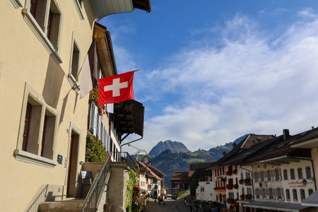 Fribourg,Switzerland-October 23,2019:The switzerland flag in The village in Gruyeres Castle on the top hill is the most view at fribourg,switzerlandのeditorial素材