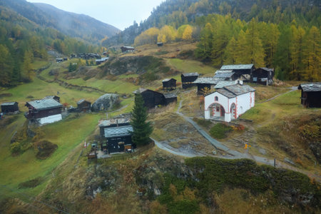 Zermatt, Switzerland-October 21, 2019:View of The Old Building on Furi cable car station in autumn and rainny day. at furi village ,Zermatt ,Switzerland.のeditorial素材