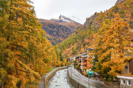 View of landscape snow alp mountain in autumn at swissの写真素材