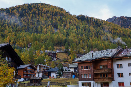 Zermatt, Switzerland-October 21, 2019:The Old Building on Zermatt Bahnhofstrasse street in autumn and rainny day. ,Zermatt is a famous nature village in Switzerland.のeditorial素材