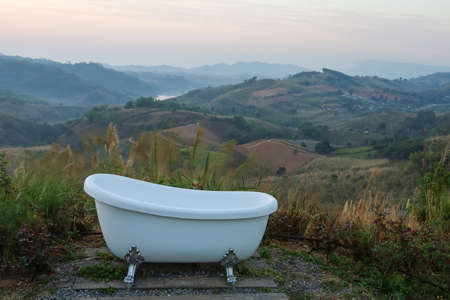bathtub on view of The morning time and landscape mountainの写真素材