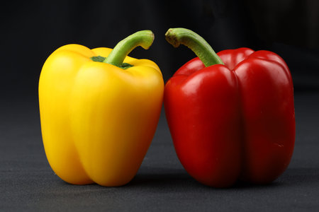 Close up yellow sweet pepper on black background