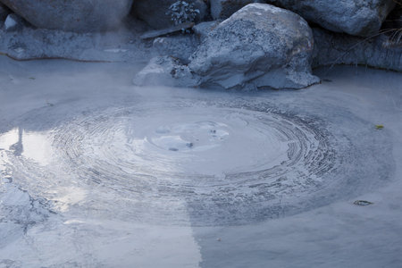Oniishi bozu jigoku is landmark in beppu,Japan. the gray mud poolの写真素材