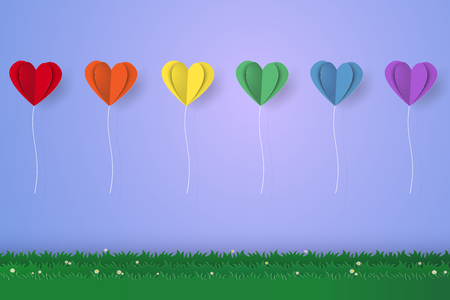 Colorful heart balloons flying over grass, paper art styleのイラスト素材