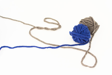 Balls of Wool Close Up on White Background , Blue and Gray Wool Isolatedの写真素材