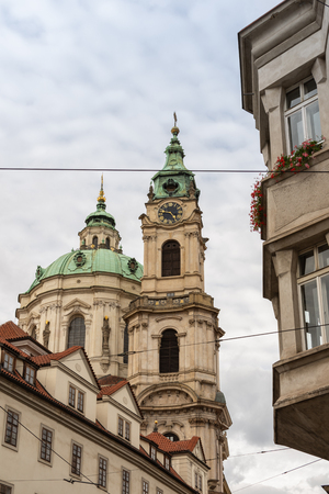 Beautiful old cathedral in the historical center of Prague, rainy sunny autumnの写真素材