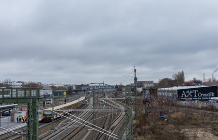 Berlin, Germany- December 12, 2018: view of the train tracks with trains from the Warsaw Bridge , Friedrichshainのeditorial素材