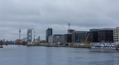 Berlin, Germany- December 12, 2018: view of the Berlin Wall and Television Tower from the Oberbaunum bridge, Spree river in winter dayのeditorial素材