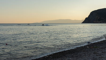 Quiet cozy sunset on the sea, beautiful evening at the seasideの写真素材