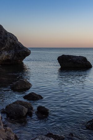 Beautiful sunset on the sea, quiet cozy evening at the seasideの写真素材