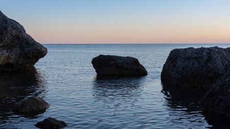 Beautiful sunset on the sea, quiet cozy evening at the seasideの写真素材