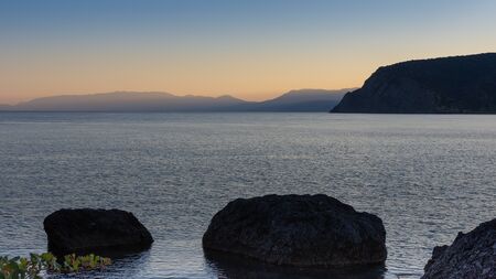 Beautiful sunset on the sea, quiet cozy evening at the seasideの写真素材