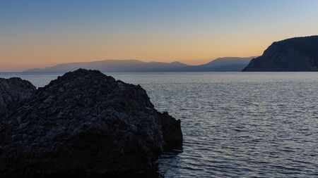 Beautiful sunset on the sea, quiet cozy evening at the seasideの写真素材