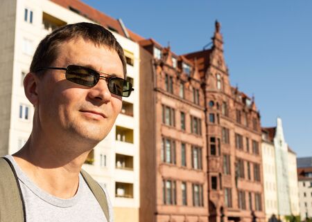 Happy tourist rejoices at the autumn sun in Berlin, Germanyの写真素材