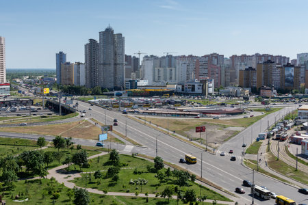 Kiev, Ukraine - May 19, 2019: view from the window of the house to the park Pozniaky and the road to Boryspilのeditorial素材