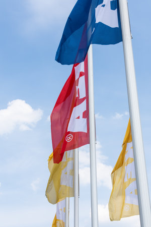 Berlin, Germany- May 24, 2019: IKEA Berlin Store, multicolored flags of IKEA on a background of clear blue skyのeditorial素材