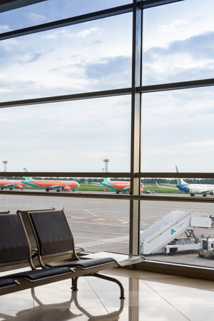 Boryspil, Ukraine - May 22, 2019: waiting hall and runway with airplanes at the Borispol airport , airplanes in front of the terminalのeditorial素材
