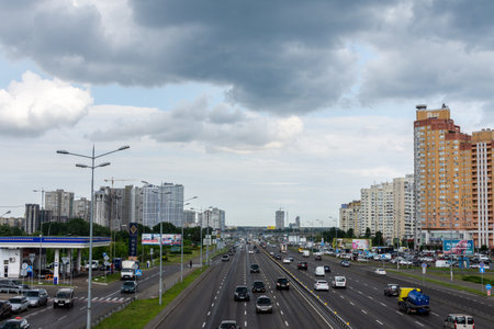 Kiev, Ukraine - May 22, 2019: view to the road to Boryspil in the city of Kiev in the neighborhood Poznyaki on a rainy dayのeditorial素材