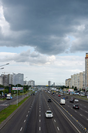 Kiev, Ukraine - May 22, 2019: view to the road to Boryspil in the city of Kiev in the neighborhood Poznyaki on a rainy dayのeditorial素材