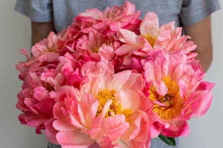 Man with beautiful bouquet of pink peonies , happy birthday or valentine's dayの写真素材
