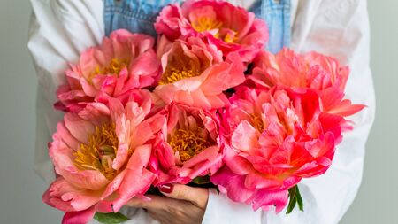 Girl with pink peonies , happy birthday or valentine's dayの写真素材
