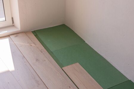 Installation laminate in the room, sheets environmentally friendly underfloor and laminate or parquetの写真素材