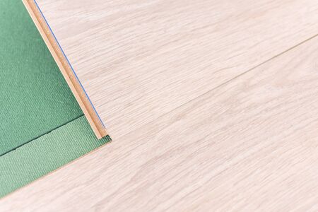 Installation laminate in the room, sheets environmentally friendly underfloor and laminate or parquetの写真素材