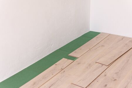 Installation laminate in the room, sheets environmentally friendly underfloor and laminate or parquetの写真素材