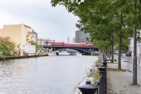 Berlin, Germany- September 28, 2019: view of the buildings and the railway bridge from the Spree embankment near the Reichstag in the Mitte region on a rainy dayのeditorial素材