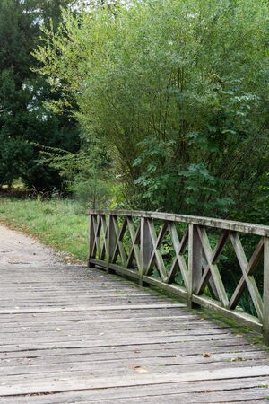Walking in the palace garden of Charlottenburg on an autumn day, small bridges over the river , a district of the Charlottenburg-Wilmersdorf boroughの写真素材