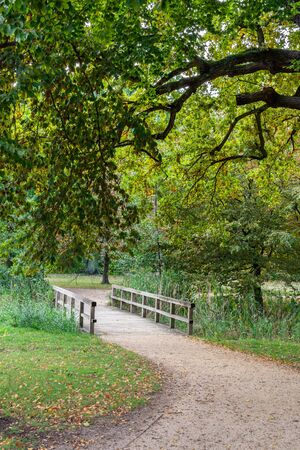 Walking in the palace garden of Charlottenburg on an autumn day, small bridges over the river , a district of the Charlottenburg-Wilmersdorf boroughの写真素材