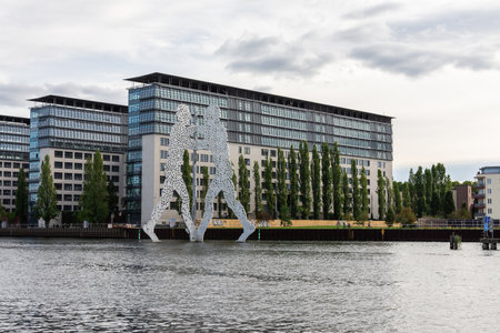 Berlin, Germany- October 6, 2019: view of the other shore from the Spree river embankment between the Oberbaunum bridge and Elsen Bridge, Molecule Manのeditorial素材