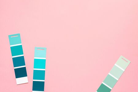 Selection of palette for painting, sample color catalog on a pink background, different shades of pink and green colorsの写真素材