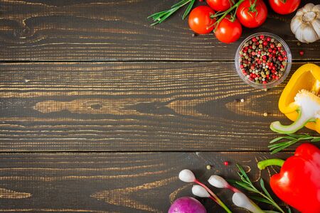 Tasty juicy ripe vegetables with spices on wooden background, vegetable background, healthy eating conceptの写真素材