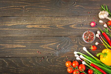 Tasty juicy ripe vegetables with spices on wooden background, vegetable background, healthy eating conceptの写真素材