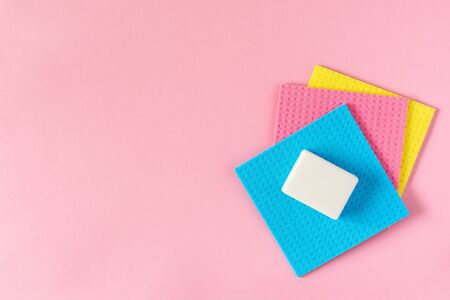 Multi-colored cloths and soap on pink backgroundの写真素材