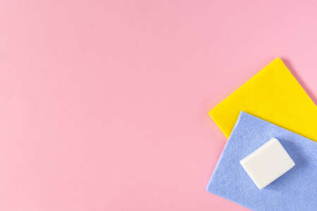Multi-colored cloths and soap on pink background , housekeeping and cleaning conceptの写真素材