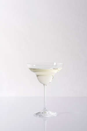Vermouth in a cocktail glass on a gray background, slightly alcoholic drinkの写真素材