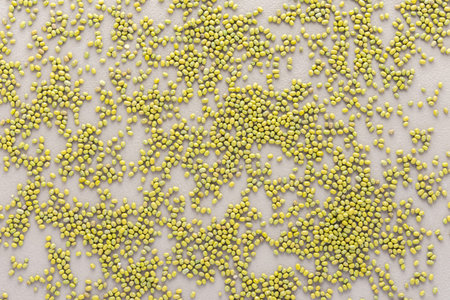Legumes are scattered in the background, natural background of mung beans , top view