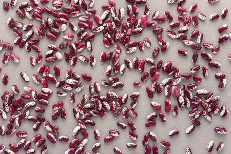 Legumes are scattered in the background, natural background of red beans, top viewの写真素材