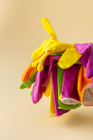 Multicolored working rubber gloves to protect hands while washing close up, cleaning conceptの写真素材
