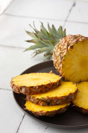 Ripe juicy pineapple cut into rings close-upの写真素材