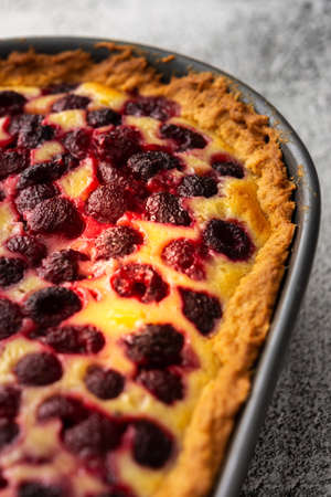 Raspberry pie with curd filling in an oval shape close upの写真素材